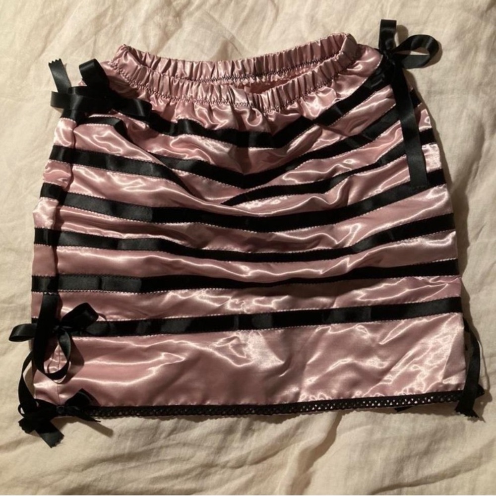 Handmade pink satin skirt with black ribbon and bow detailing